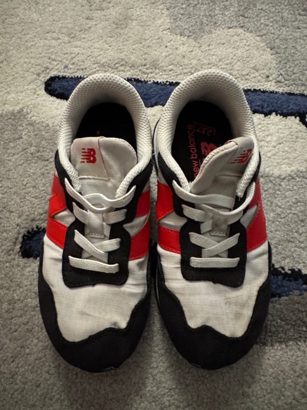 New Balance Kids White, Red, and Black Sneakers